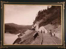 Рабочие во время [укладки железнодорожного полотна] вдоль реки Сим.